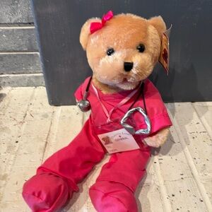 Chantilly Lane Musical Bear in Pink Scrubs